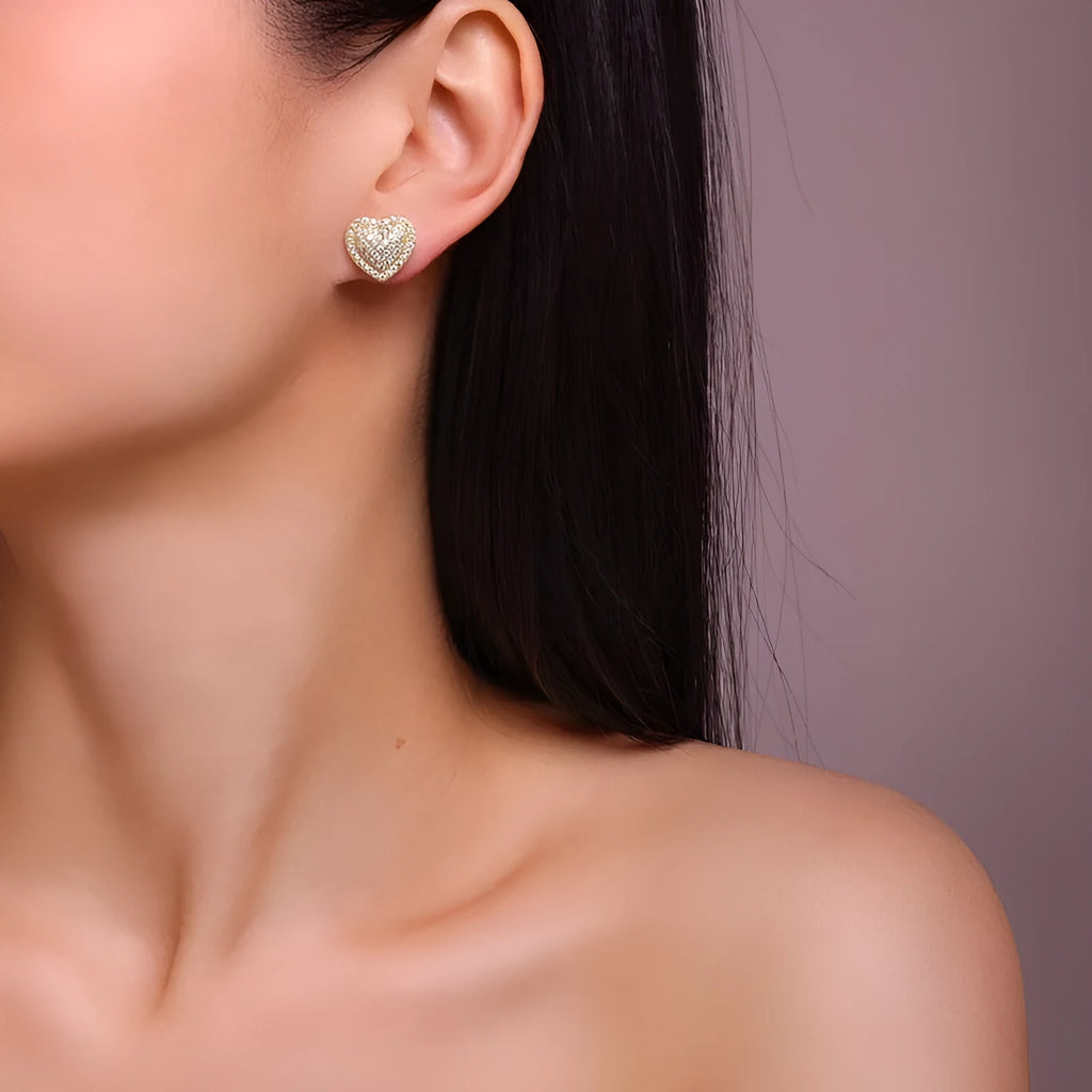 Gold plated heart shaped moissanite stud earrings with sterling silver posts