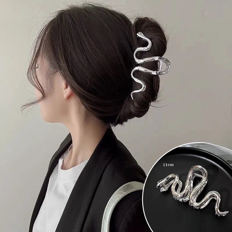 Silver metal hair clip with Slytherin serpentine snake design measuring 10.5 cm