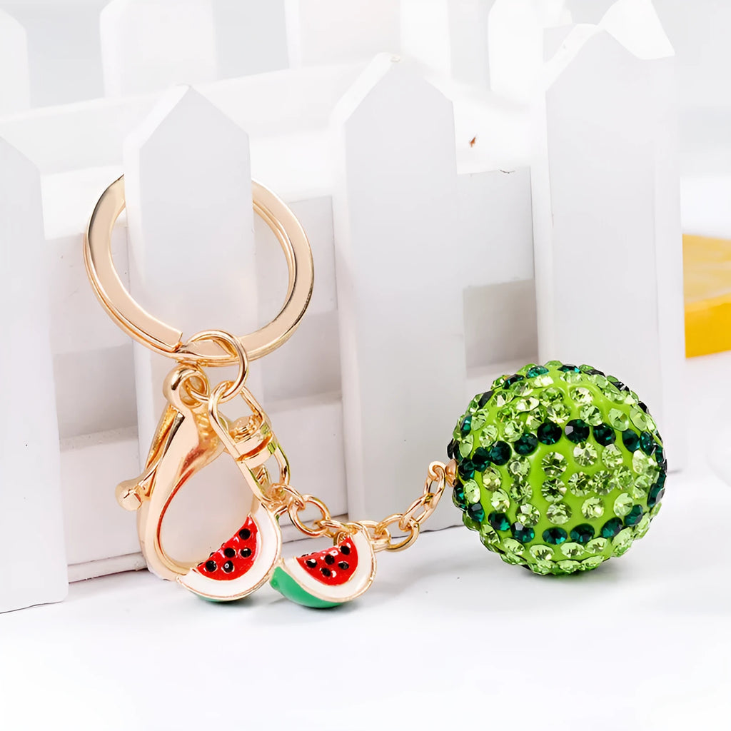 Green zinc alloy watermelon slice keychain on a white background