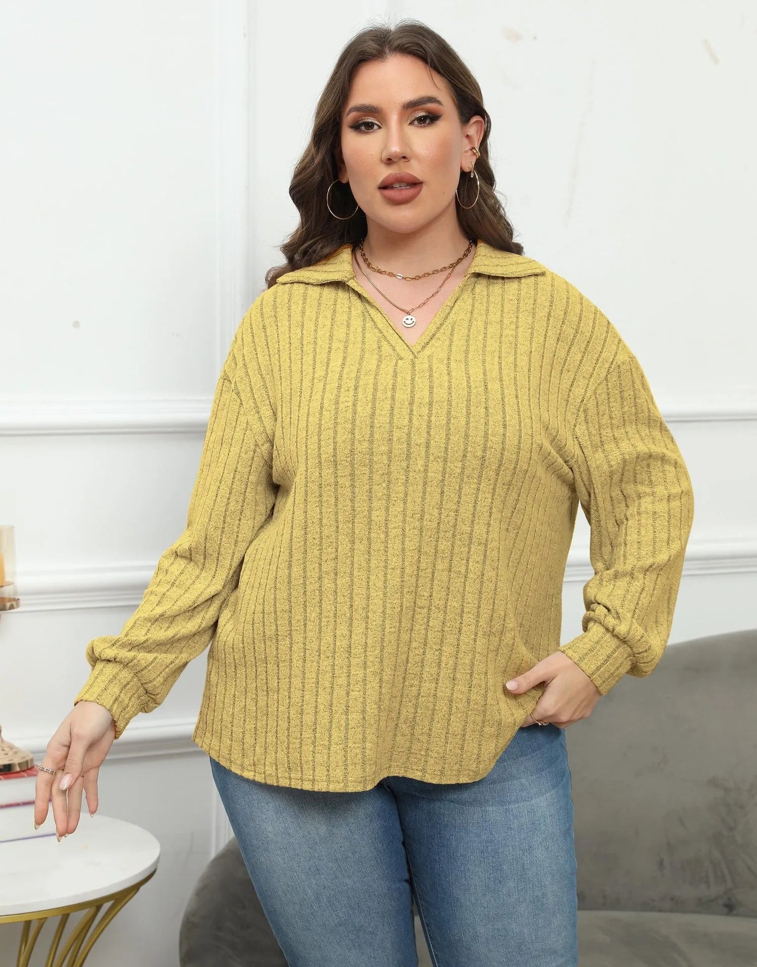 Women's plus size grey polo collar fleece shirt with lantern sleeves on a hanger.
