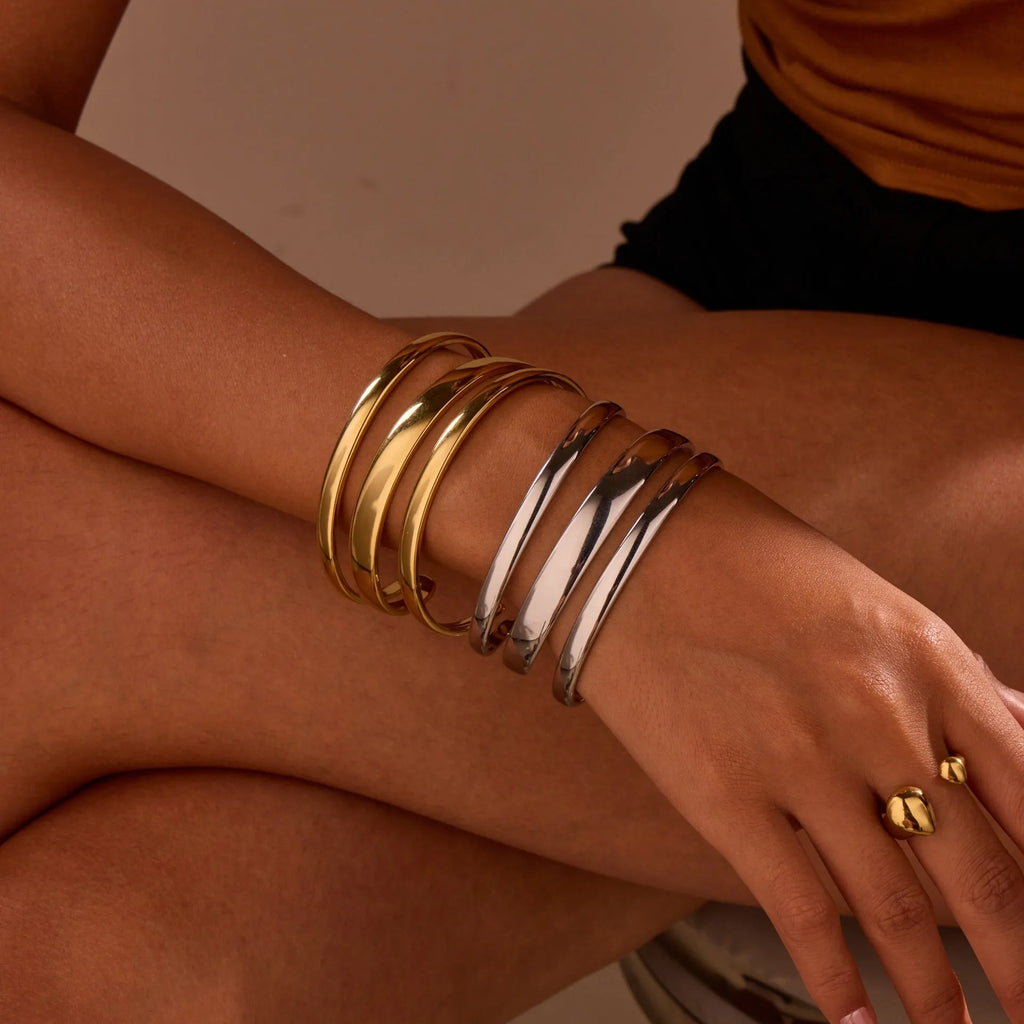 Women's stainless steel bracelet with 18K gold electroplating in geometric open design with line elements