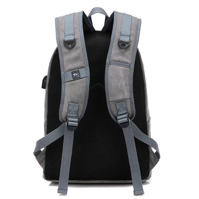 Canvas backpack with USB charging port showing computer pocket and available colour options