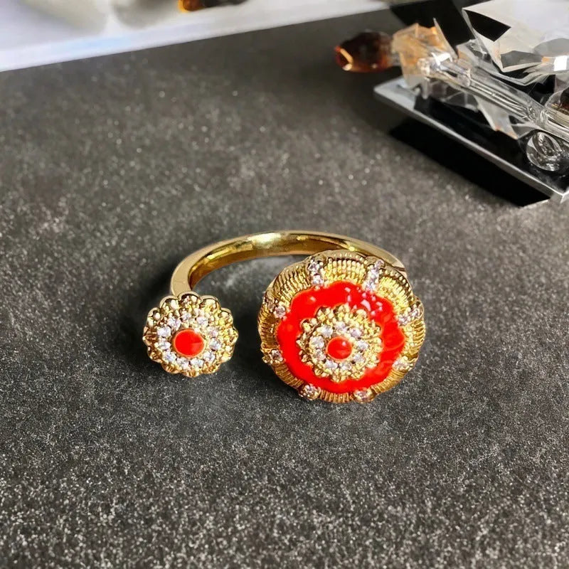 Adjustable Chinese gourd ring with zircon inlay showing floral and bow elements in oil-drip finish