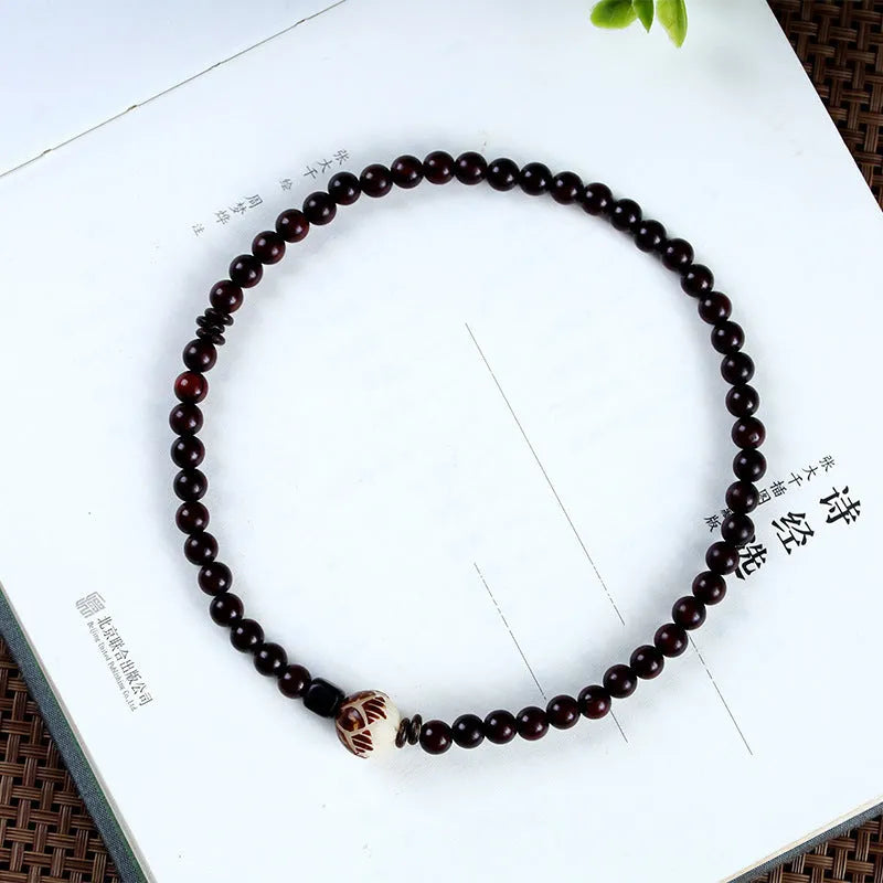 Natural rosewood double-ring bracelet with floral shape measuring 10mm wide, hand-knitted construction