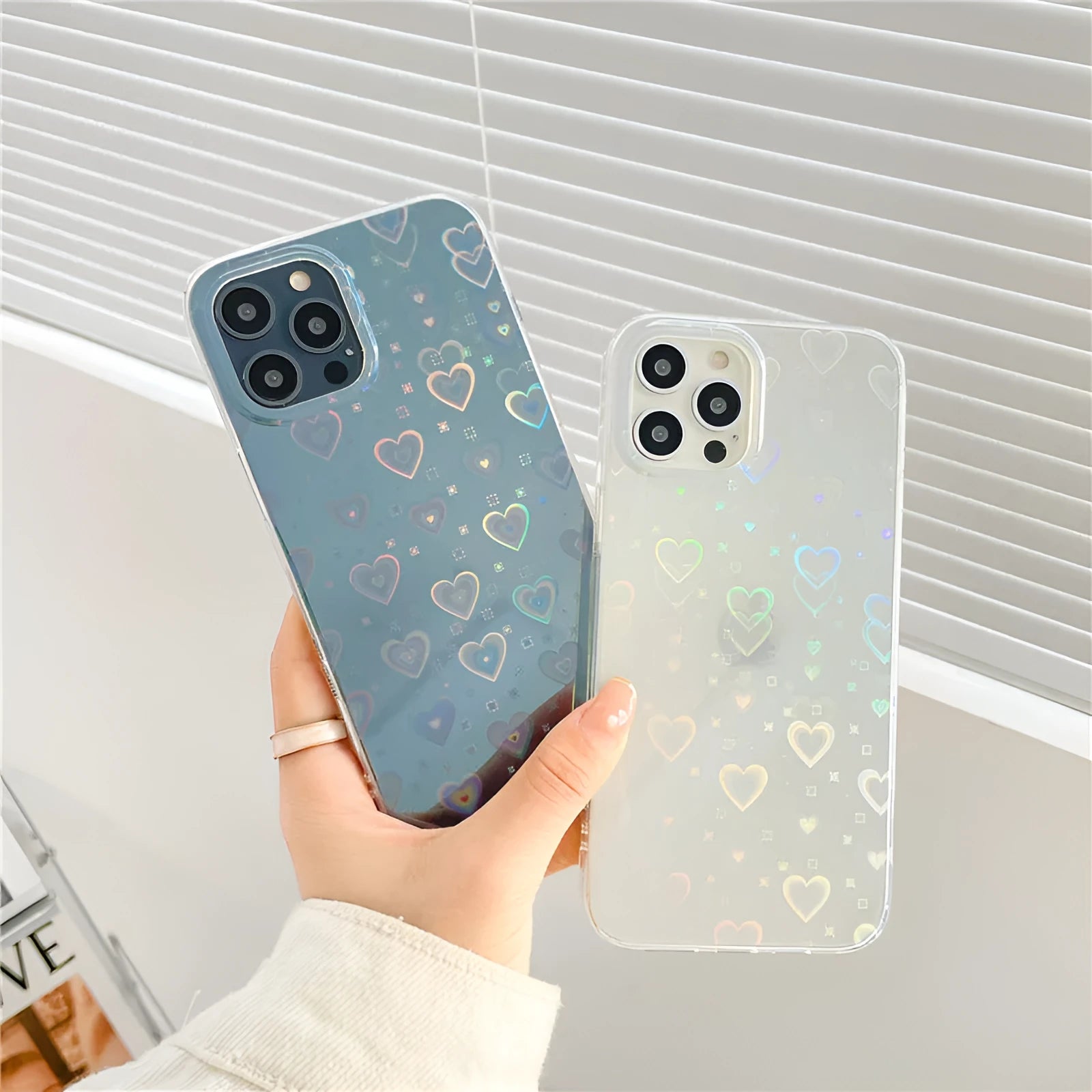 Transparent silicone iPhone case with laser-etched Love design on the back.