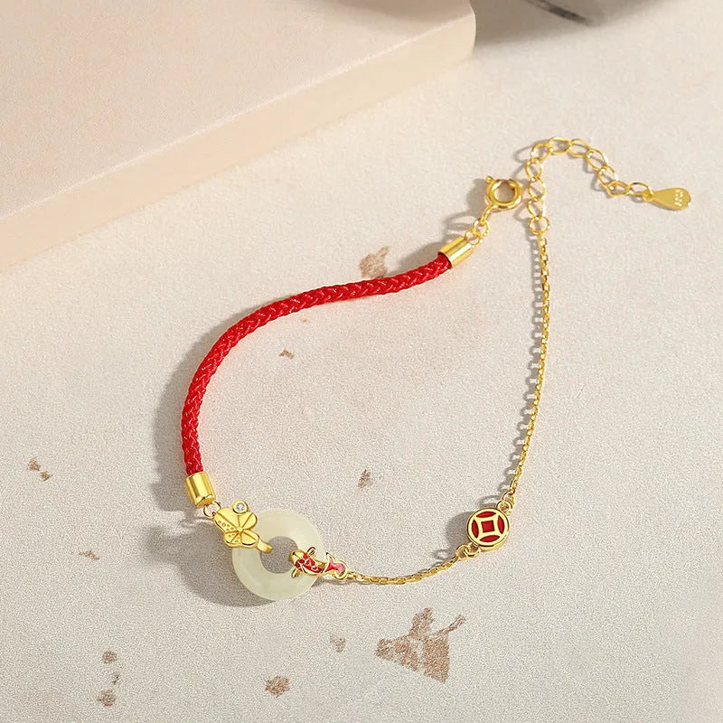 Women's koi peace buckle bracelet in 925 silver with electroplated gold finish on red rope