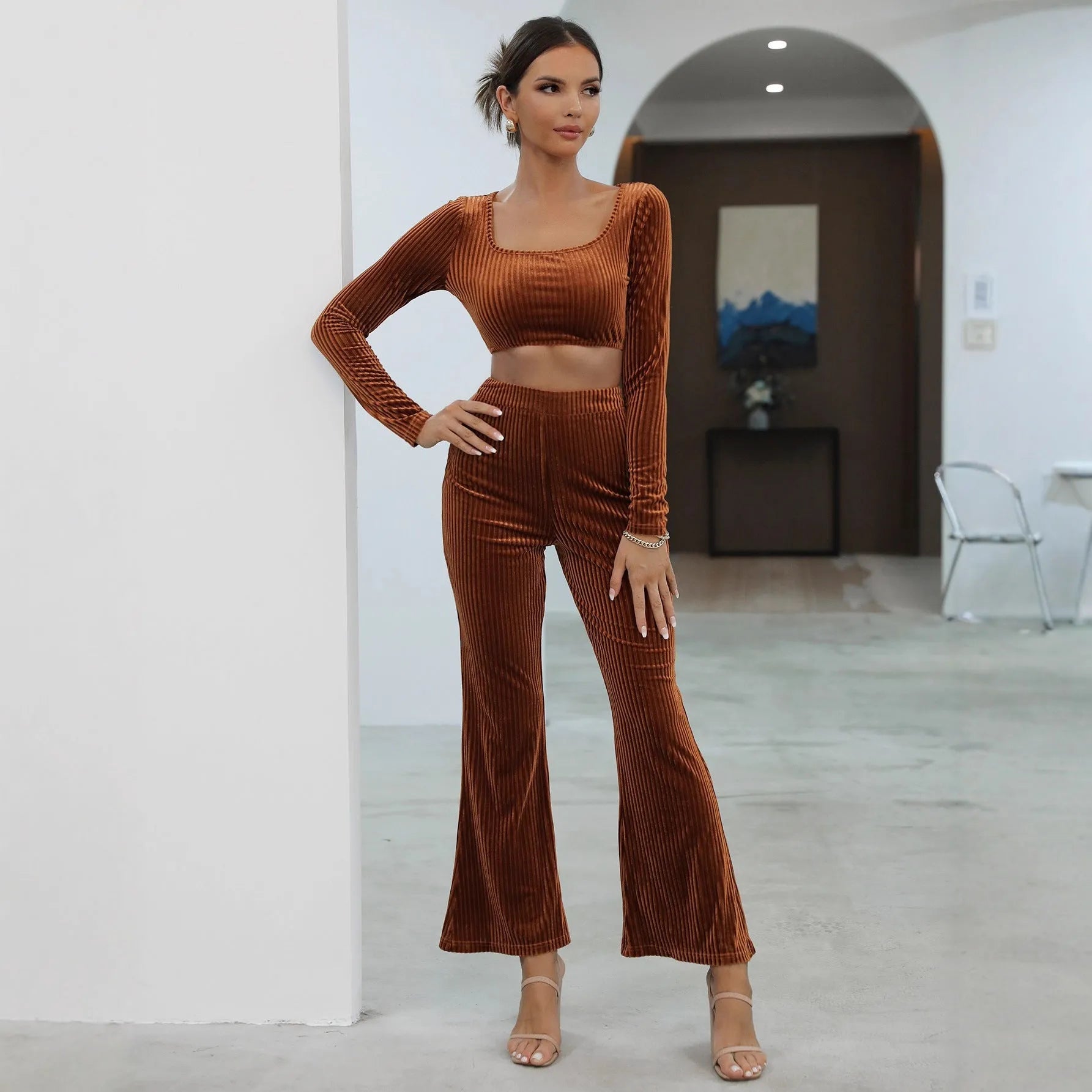 Caramel coloured long sleeve sweater and trousers casual set laid flat.