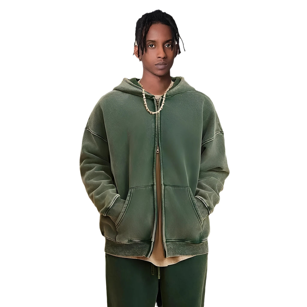 Man wearing a washed black fleece-lined hooded cardigan sweater with a double zip.