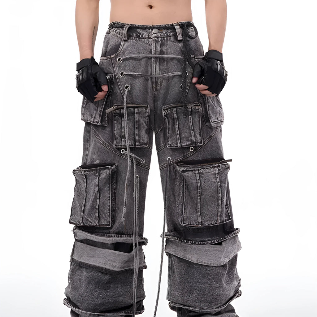 Grey distressed denim overalls for men with rope stitching on the legs and a mop pant cut.