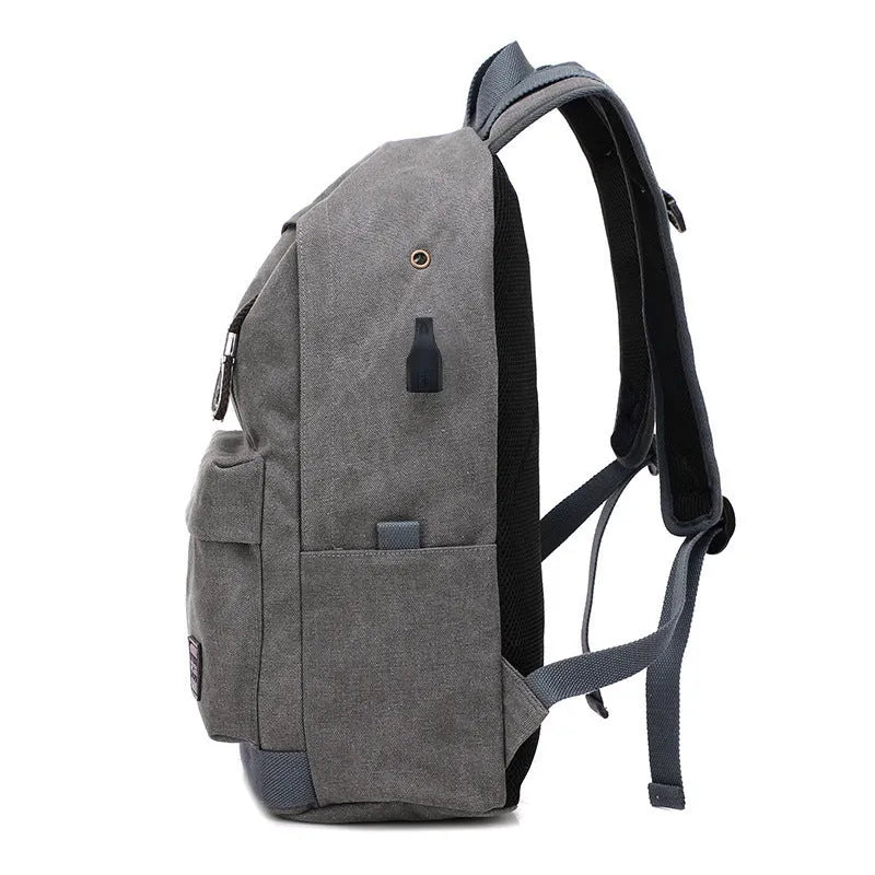 Canvas backpack with USB charging port showing computer pocket and available colour options