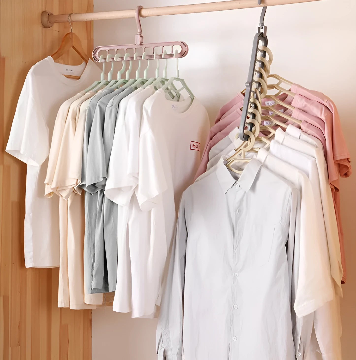 Plastic clothes hanger with rotating hook in pink colour, showing 33cm length dimension