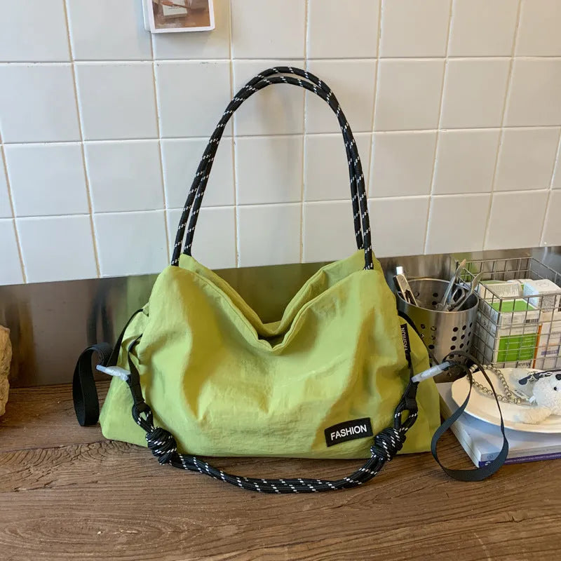 Large capacity soft cloth crossbody bag in beige with sewn detail, available in six colours