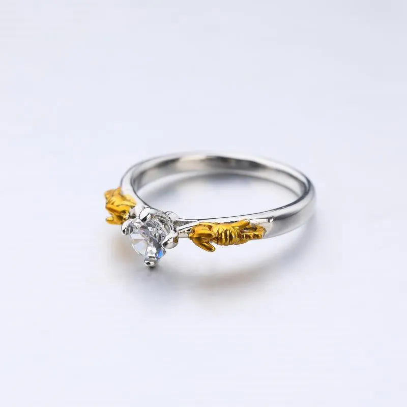 Crown-shaped copper cosplay ring with black gold finish and crystal detail.