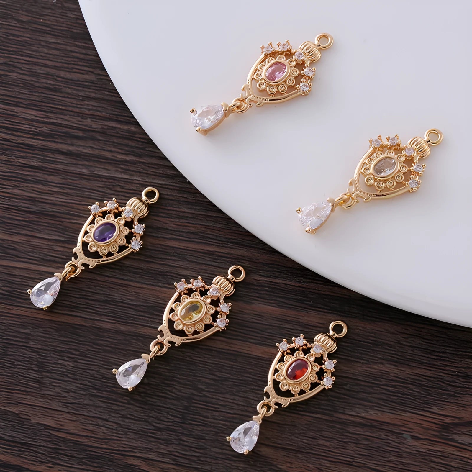Small water drop-shaped pendant with hollow crown design and micro-inlaid zircon details.