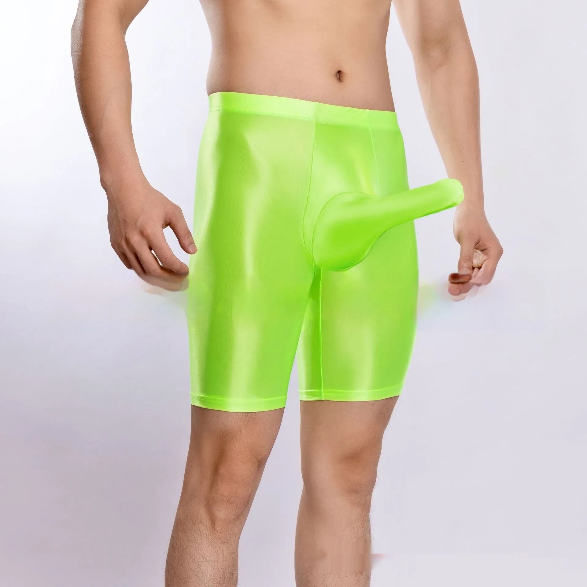 Man wearing shiny black plus size nylon sports shorts, showing silky finish.