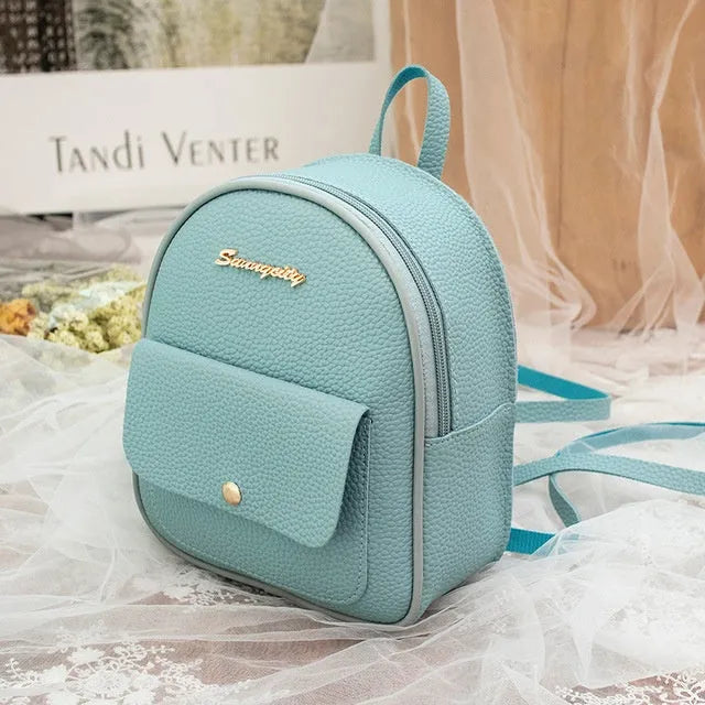 Women's small black PU leather backpack shoulder bag showing front zipper and dimensions