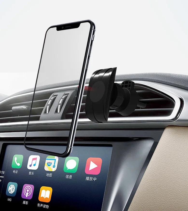 Black car phone holder mounted on vehicle air vent with adjustable clamping arms extended
