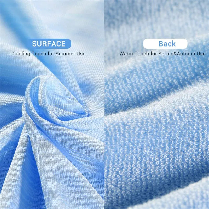 Blue and grey cooling blanket with Japanese Q-Max fibres on a bed.