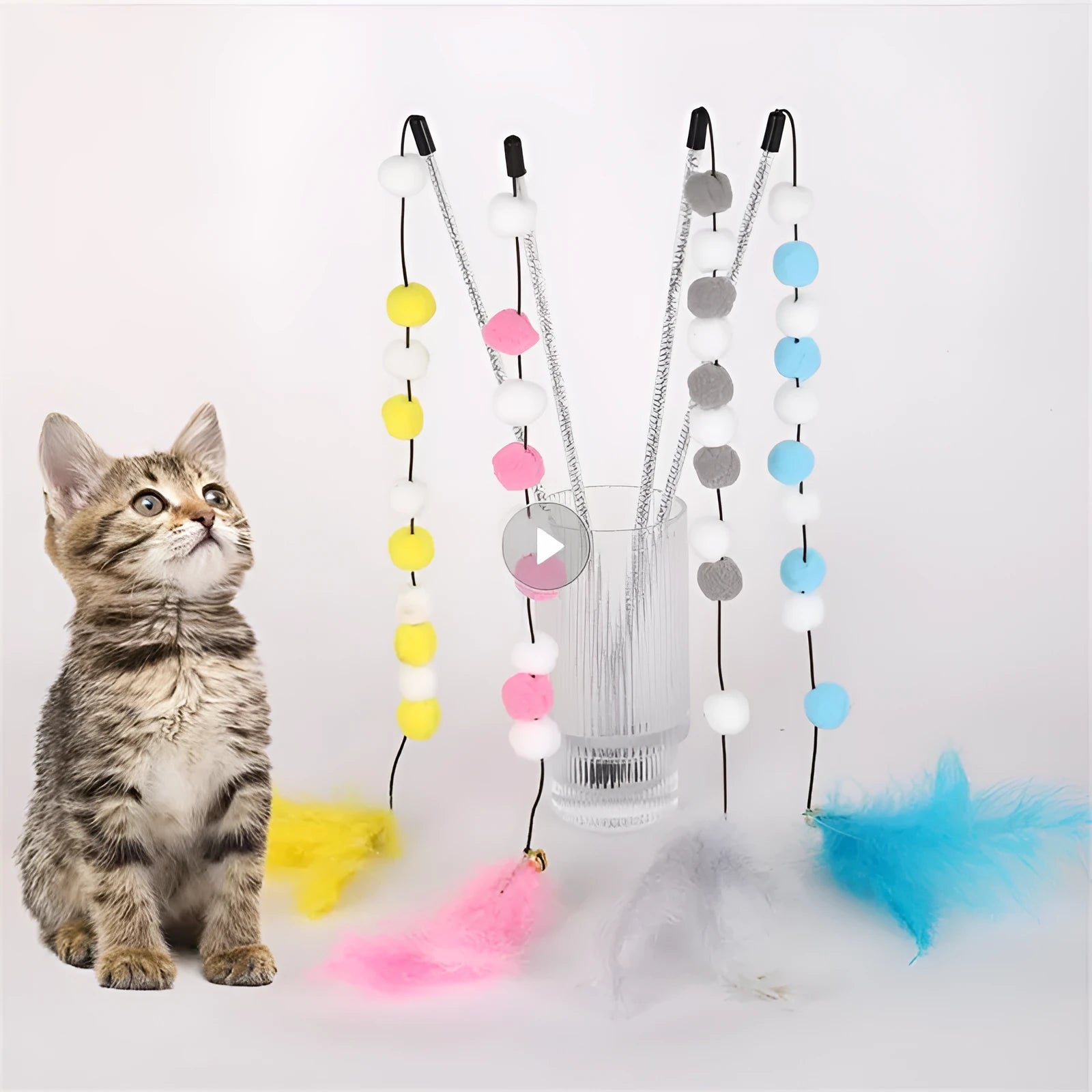 31 cm long cat teaser toy rod with bell and pompon feather attachments in blue colour