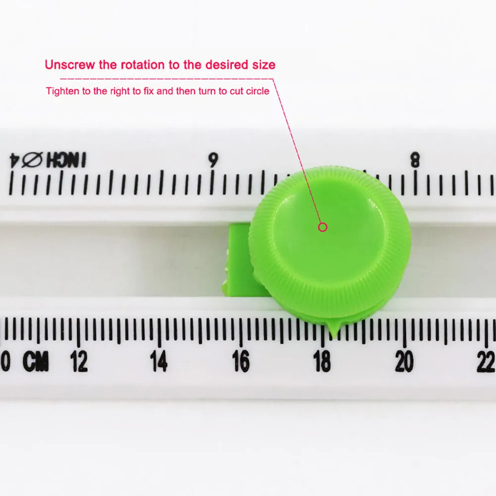 Green or orange plastic round paper cutter for A3 sheets on a colour box