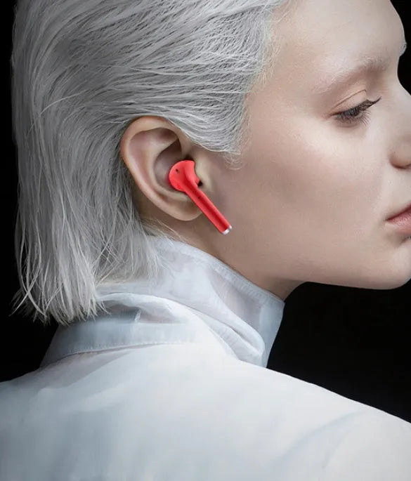 Lipstick-style wireless Bluetooth earbuds in charging case with curved in-ear design available in four colours
