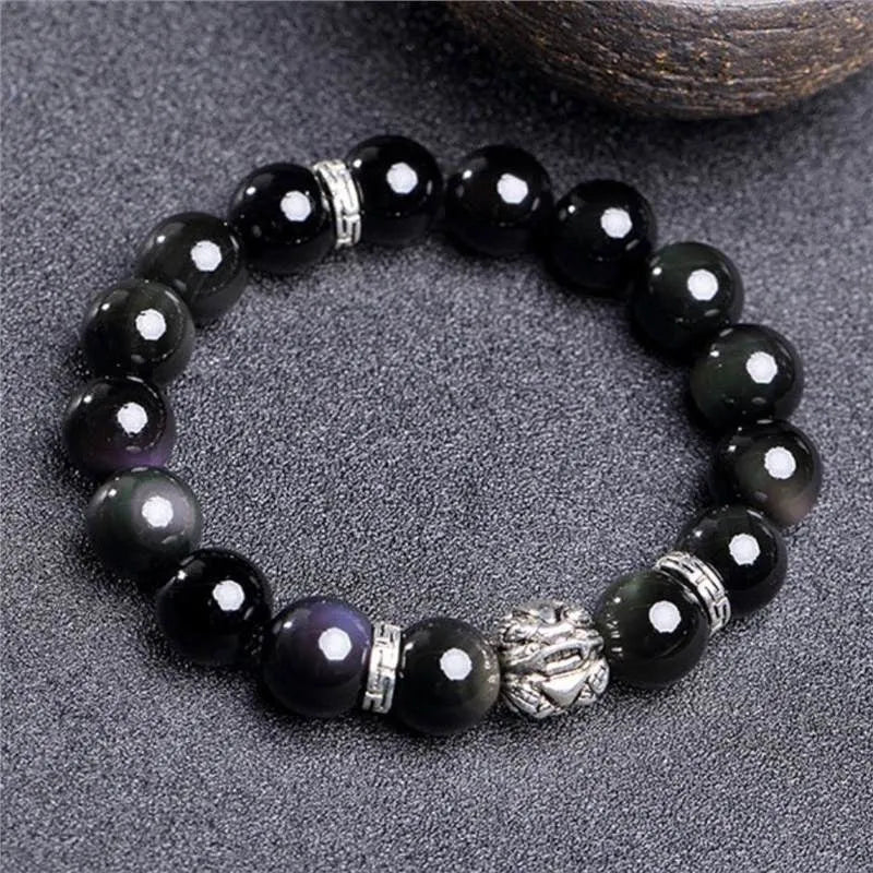 Natural obsidian stone bead bracelet with a silver clasp, shown in male 12mm and female 10mm size options.