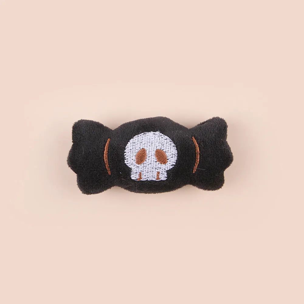 Small cat teaser wand with a soft plush head in eyes, candy, or skull design