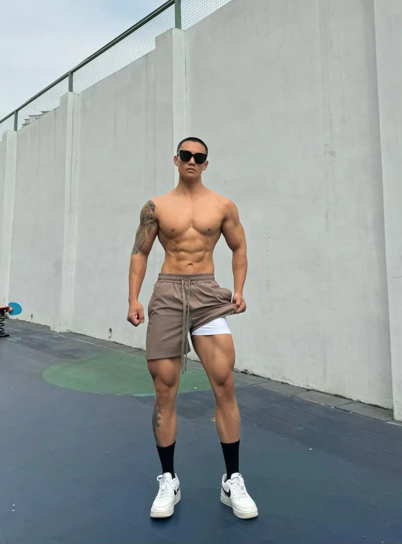 Men's ice silk quick-drying double-layer casual shorts in nylon fabric on a colour swatch background.