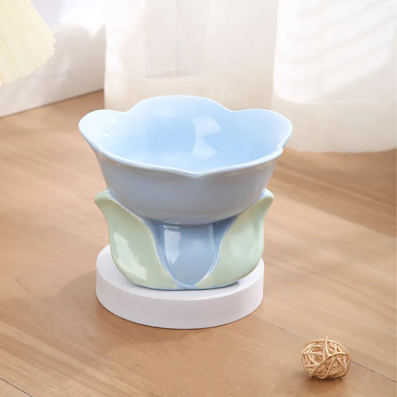 Blue floral patterned ceramic raised pet bowl with non-slip base for cats or small dogs.