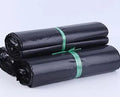 Black, grey, green, and white PE courier bags with adhesive sticker seals in various sizes.