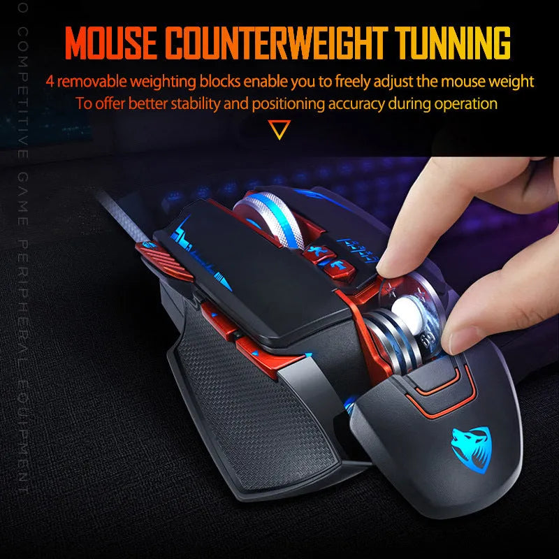 Black Thunder Wolf V9 wired gaming mouse on a desk, showing its ergonomic shape and USB cable.
