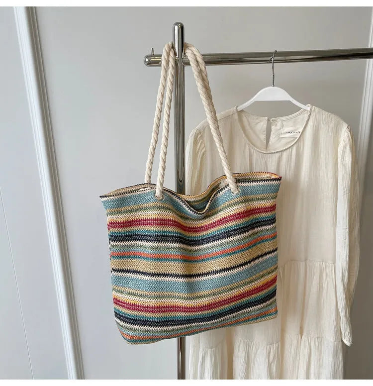 Blue woven nylon shoulder bag with straw-inspired basket construction and polyester lining