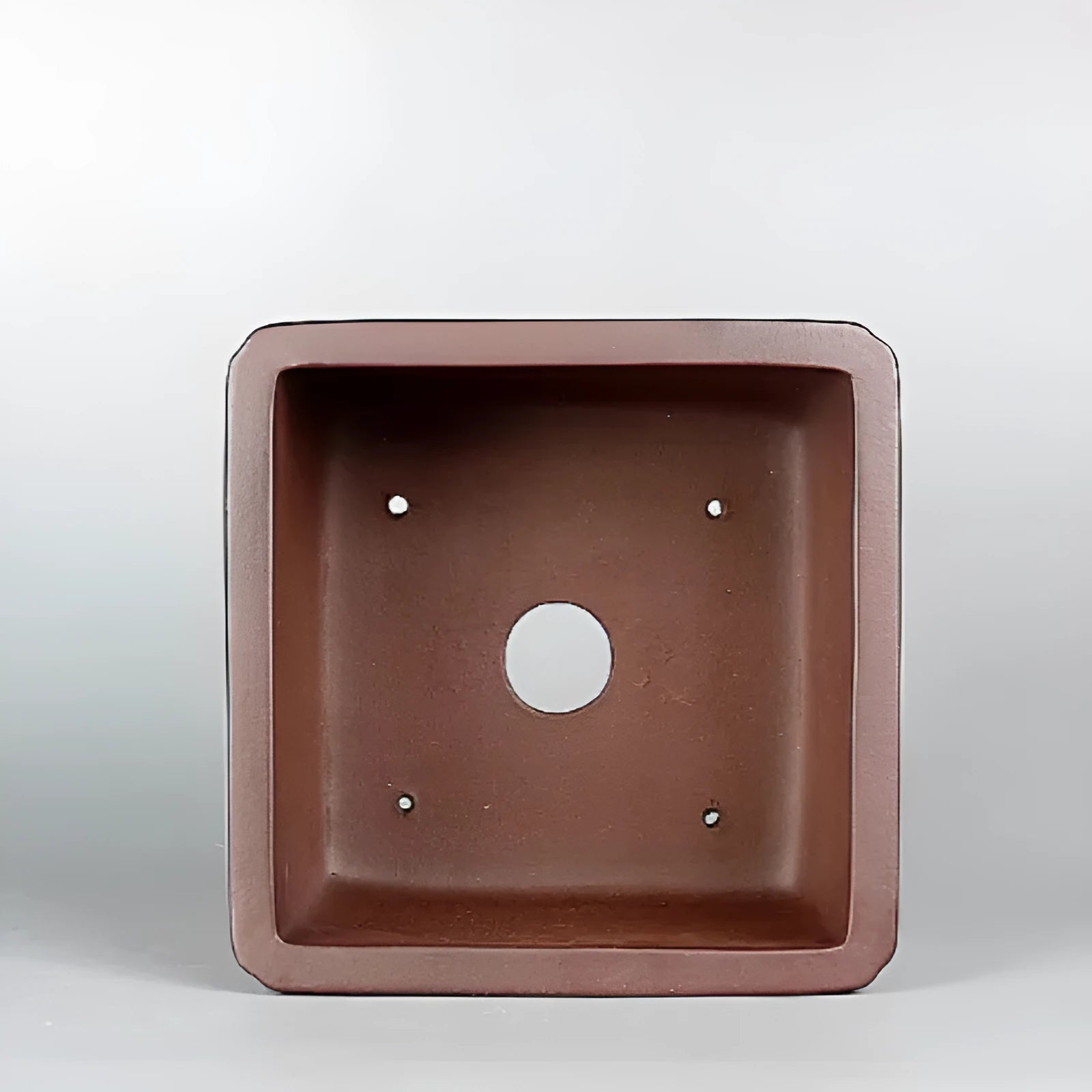 Brown antique purple clay flower pot with classical style and drainage hole