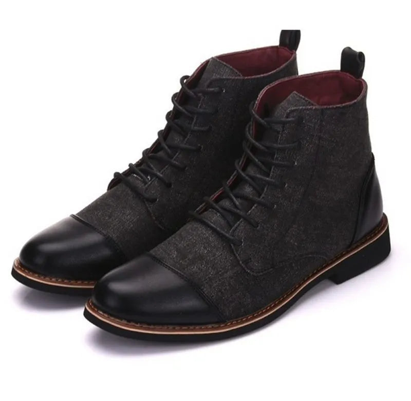 Men's black leather motorcycle-style ankle boots with belt buckle and rubber sole.