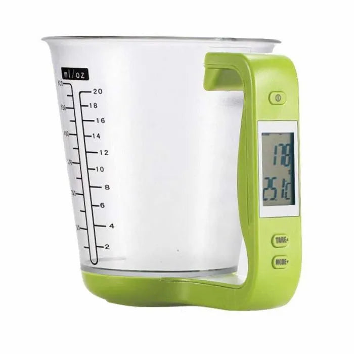 Green electronic kitchen scale measuring cup with digital LCD display on handle.