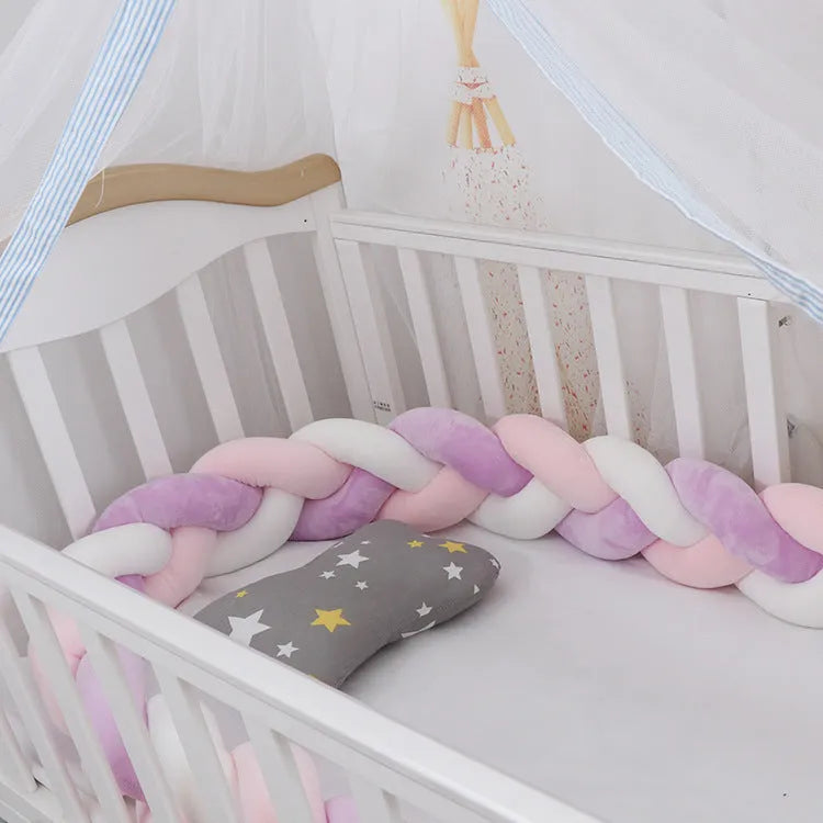 Braided knot crib bumper in spandex velvet, showing flexible length options for cot protection.