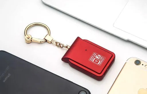 Black leather Bluetooth dual SIM adapter keychain for iOS phones with micro USB port.