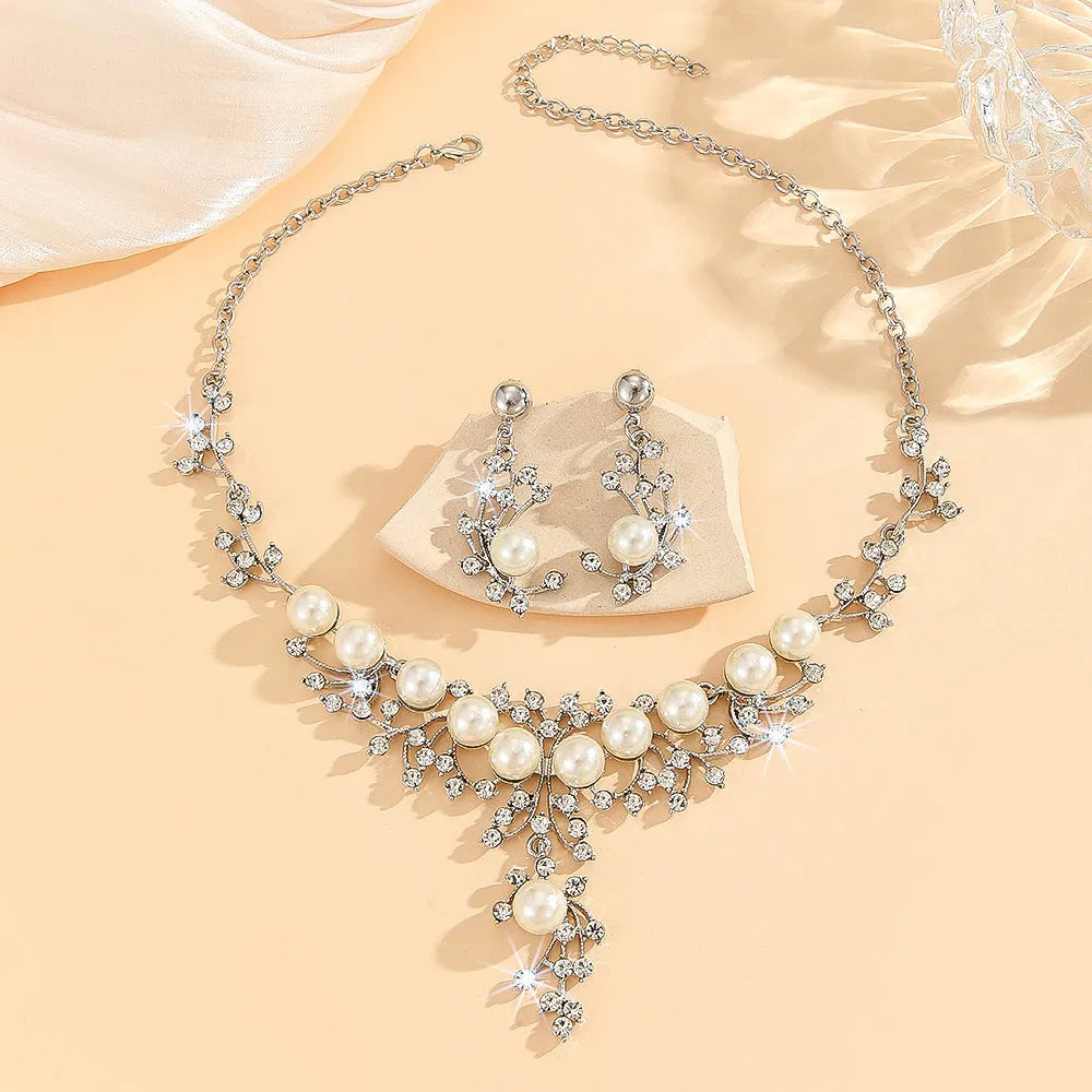 Women's fashion necklace and earrings set in gold or white with alloy construction and floral pattern
