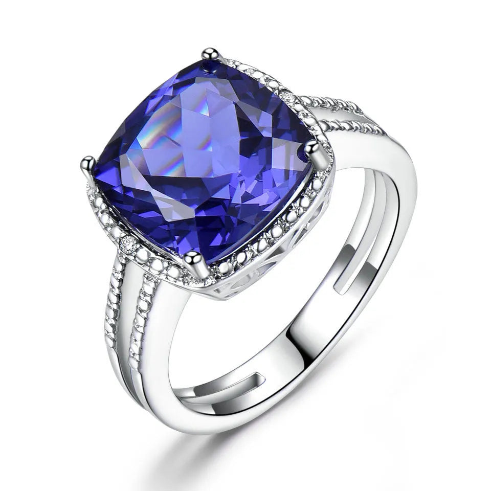 Women's sterling silver ring with a blue Tanzanite gemstone, shown in UK size options 6 to 10.