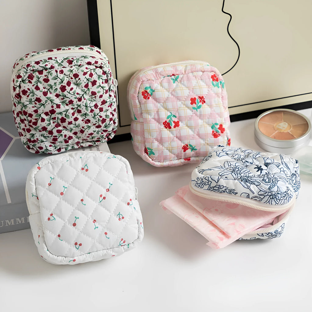 Women's floral patterned polyester key storage bag with sewing thread detail.