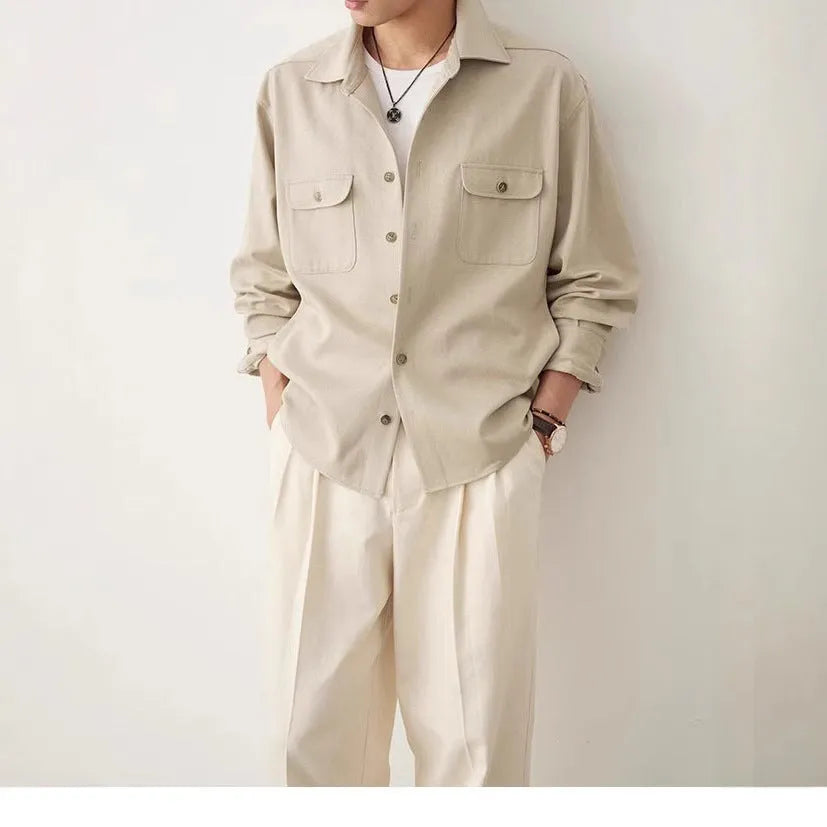Men's simple profile lapel shirt in light sand rice colour, showing long sleeves and front button placket.