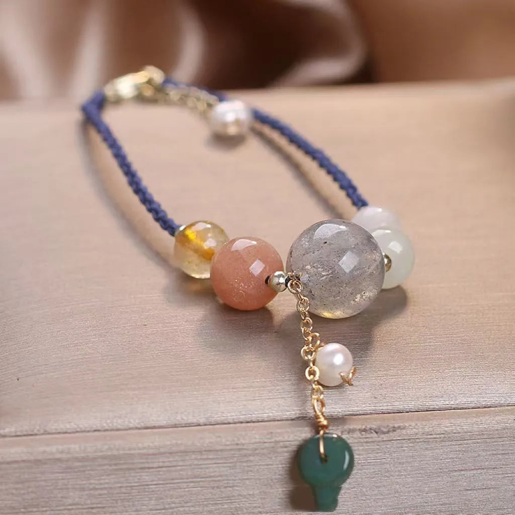 Hand-woven crystal bracelet with sequin details and adjustable buckle in three colour options