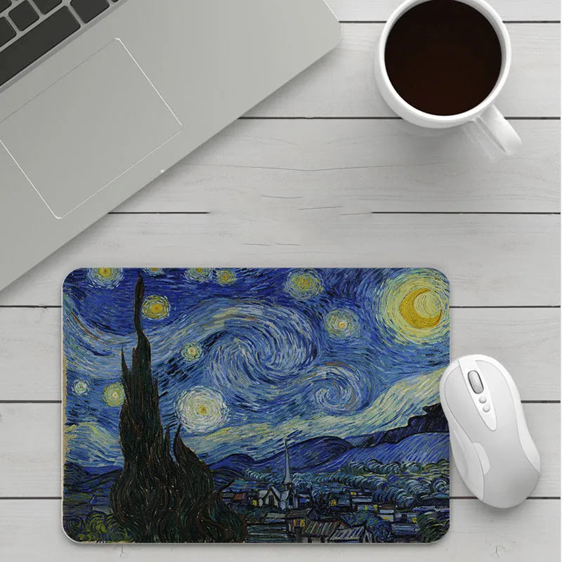 Custom cartoon design on a small black thickened mouse pad with stitching, shown on a desk.