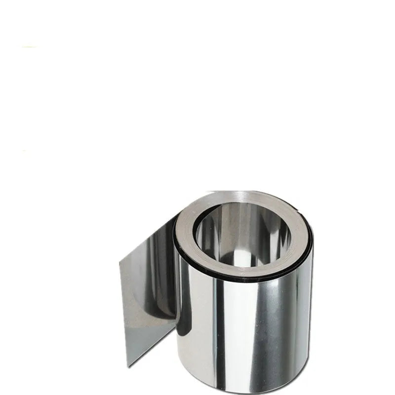 304 stainless steel metal shim strip on a workshop bench with a ruler showing its thin gauge.