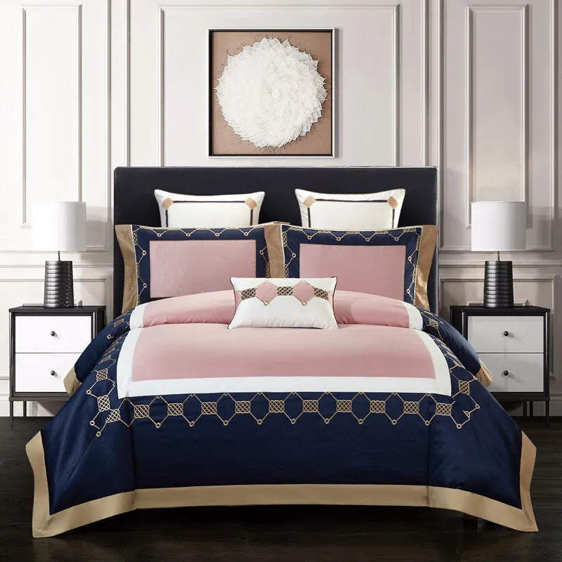 A four-piece cotton bedding set with embroidery, shown in one of five available designs.