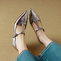 Women's gun colour leather pumps with a chunky mid heel and round pointed toe.