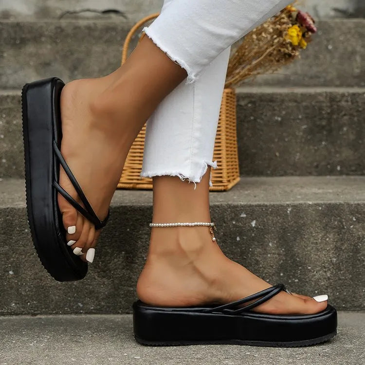 Women's thick sole flip-flops in multiple colours with herringbone pattern PU strap and rubber sole.