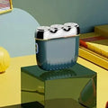 Three-head magnetic electric shaver in gun metal, orange, green or blue colours with floating cutter adjustment