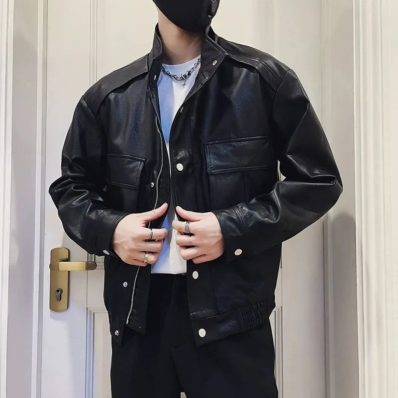 Men's black Korean style PU leather jacket with side pockets on a hanger