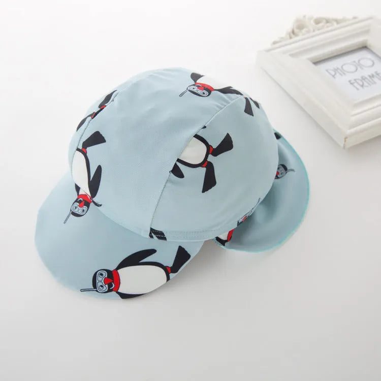 Boy's penguin print swim set with long sleeves and matching swimming cap for ages 2-7 years